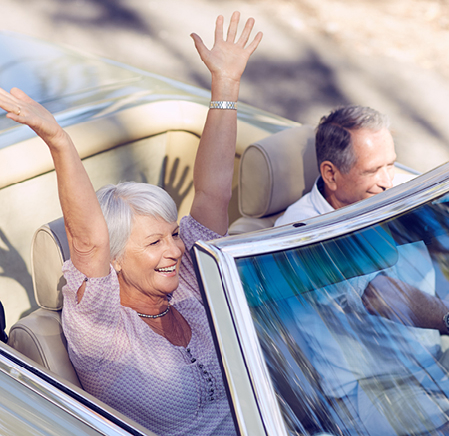 People happy riding in a car